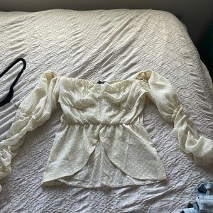 Pretty blouse. Classy little show of the tummy.